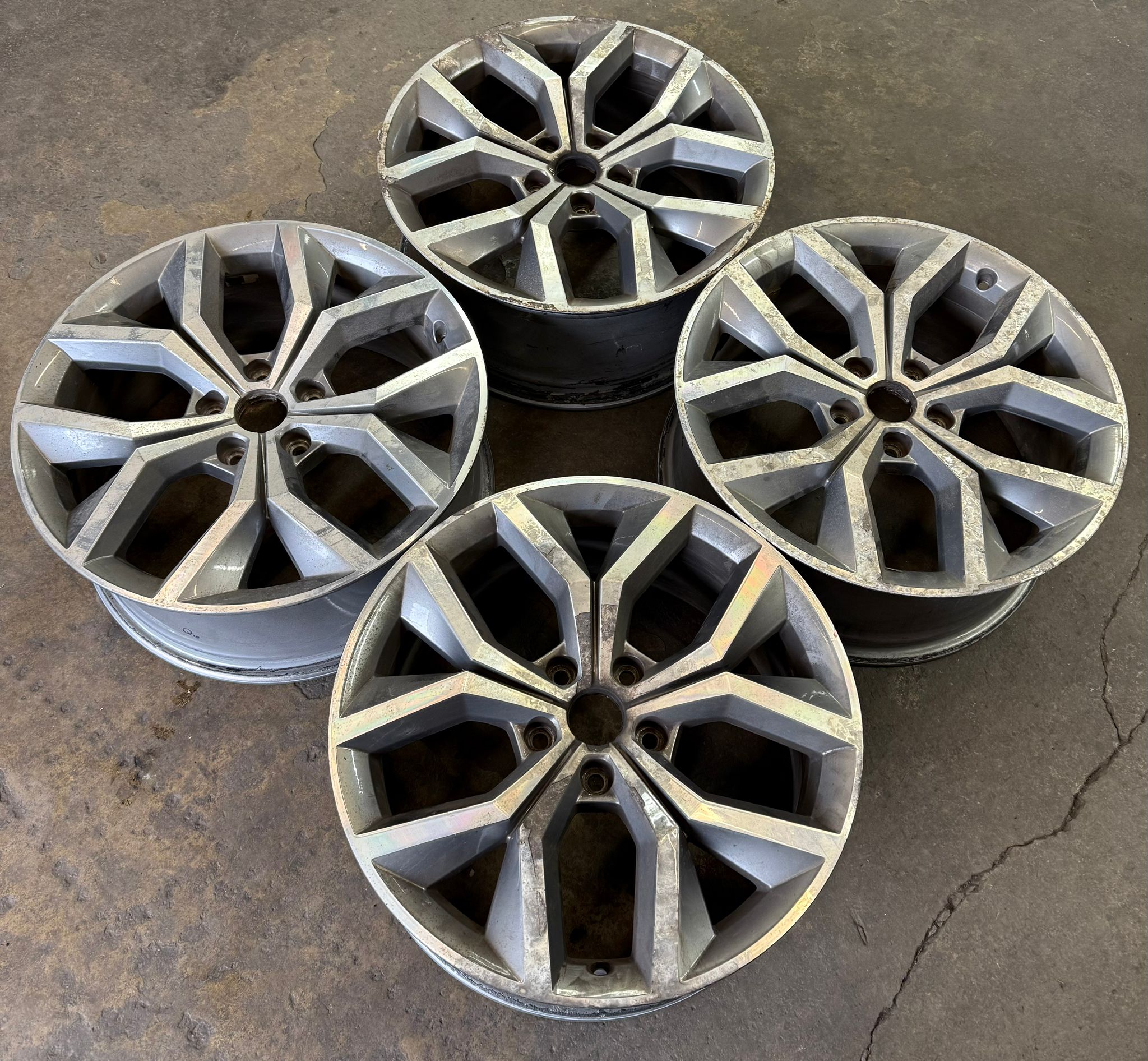 Before — A full set of oxidised, weather-worn alloys stripped and powder-coated in a fresh anthracite. — Burnley