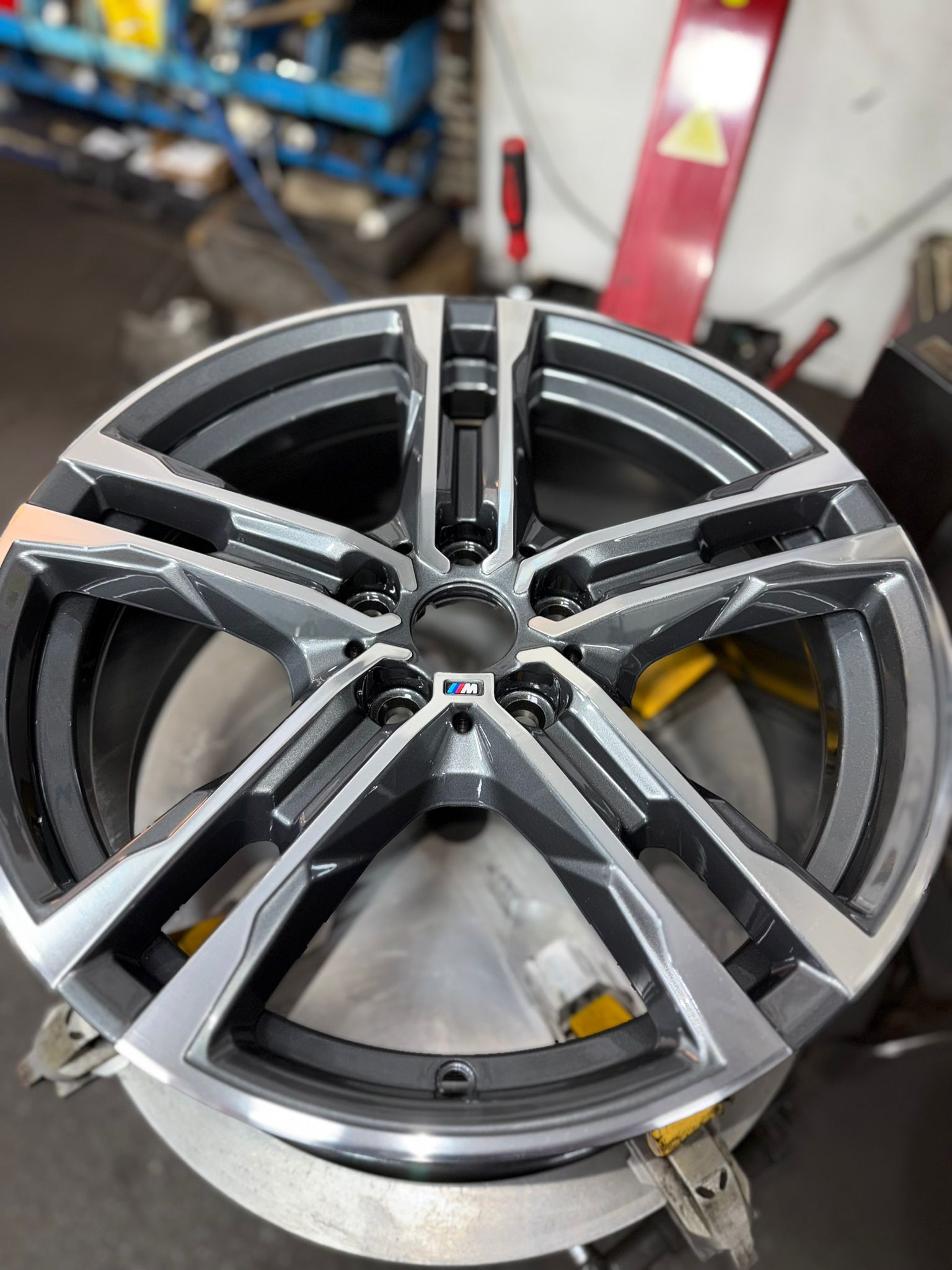 After — A kerbed, corroded BMW M wheel cut back on the lathe for that bright machined face and refinished in gunmetal. — Burnley